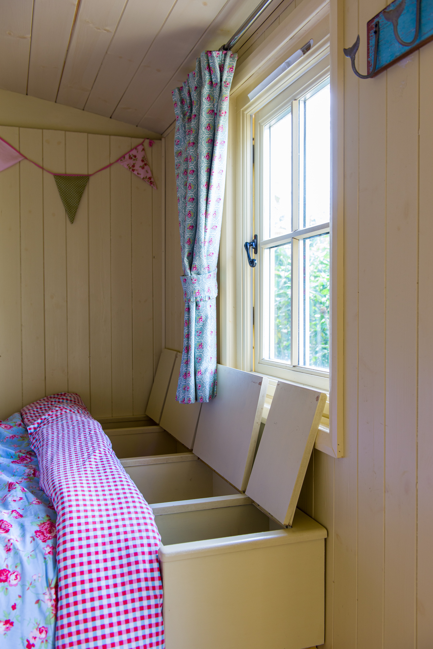 Interior of the shepherd's hut showing one of the storage options hut interior